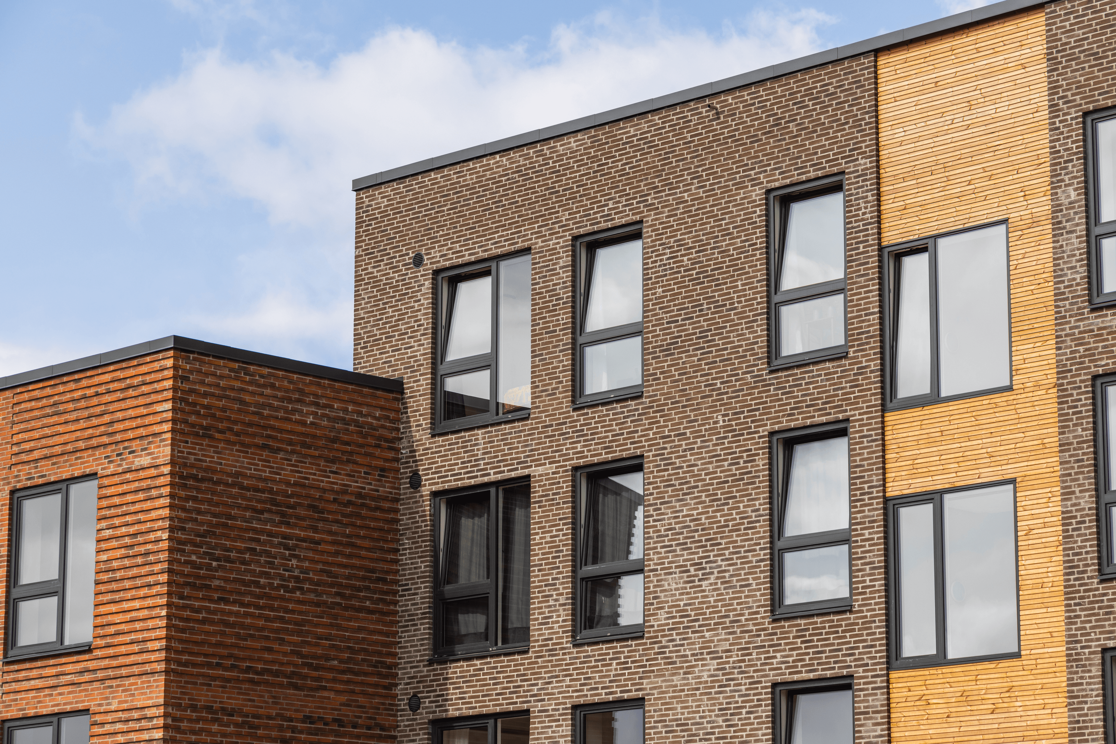 Exterior view of the Triumphbyen building façade.