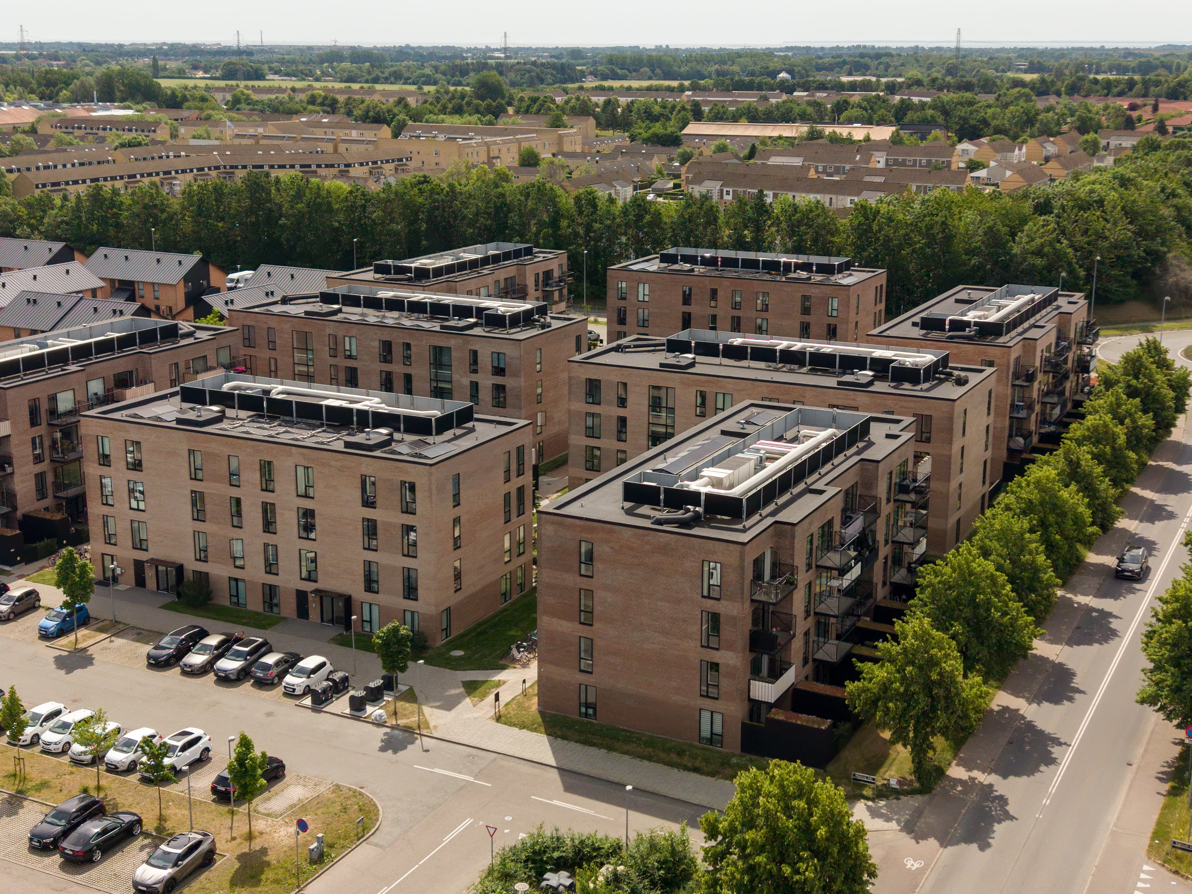 Image taken from the outside, providing an overview of several of the property’s buildings. The property is Agerhusene, located in Høje-Taastrup.