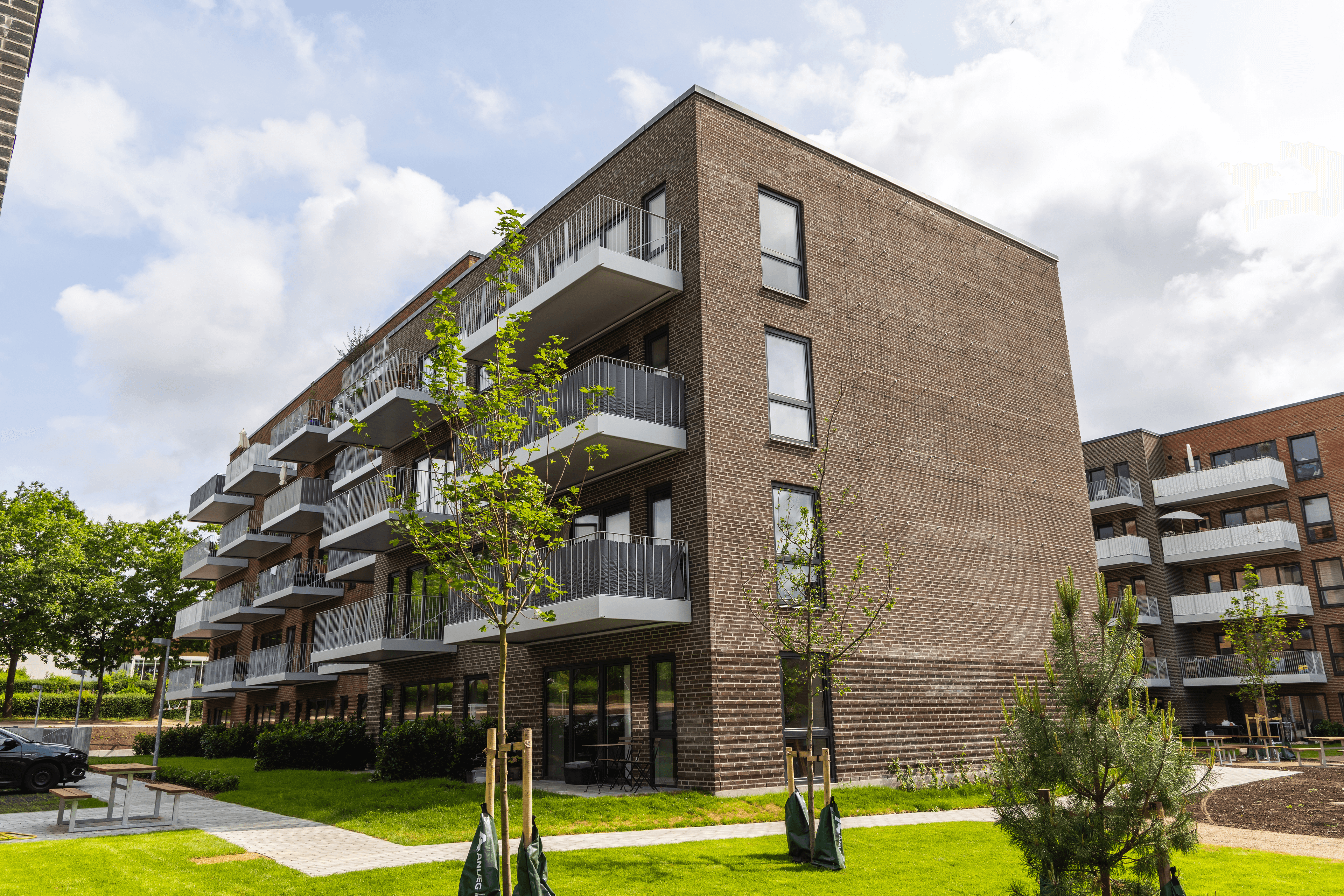 Exterior view of Triumphbyen in Espergærde showing the building façade with balconies.