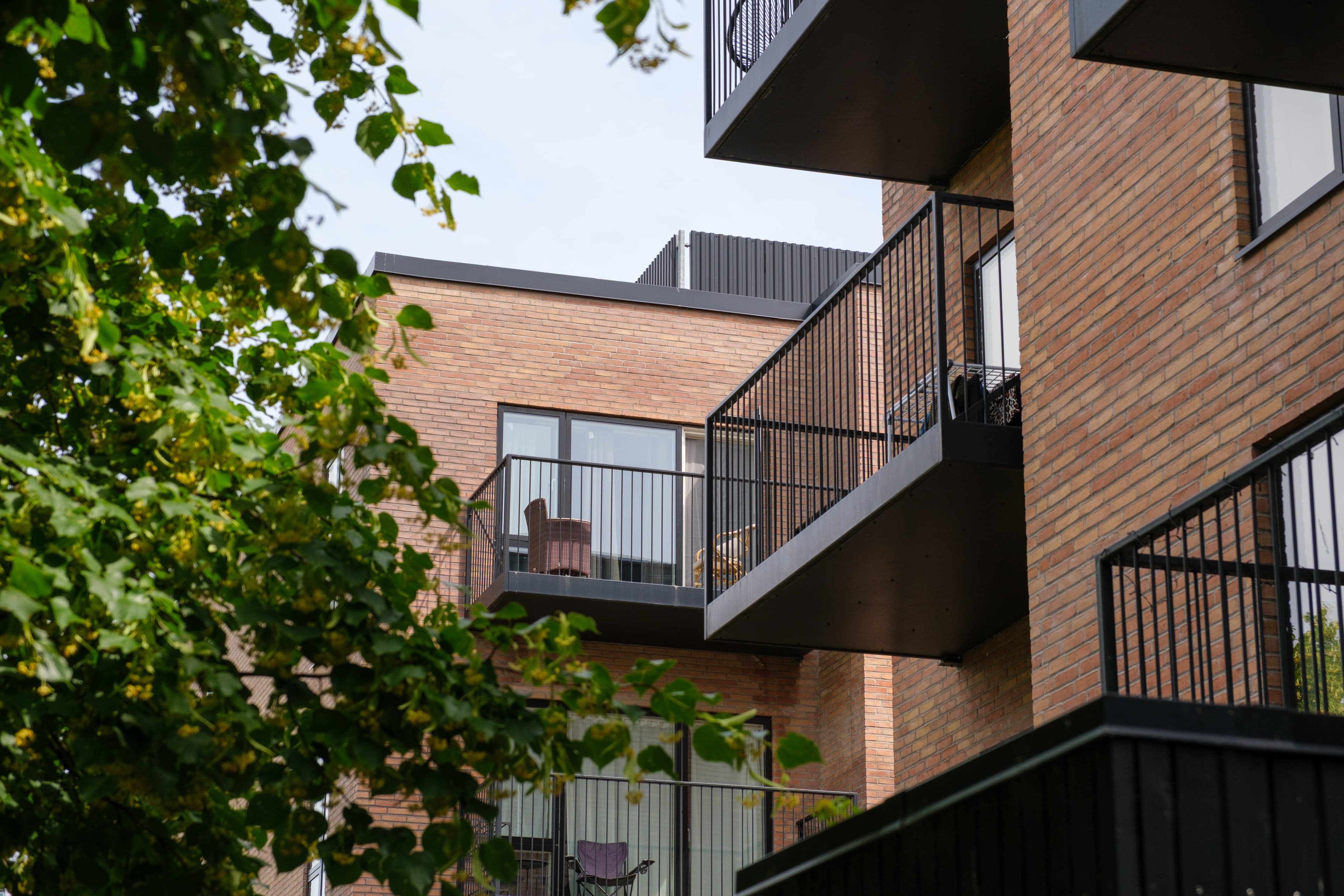 Façade with balconies and green landscaping. The property is Agerhusene, located in Høje-Taastrup.