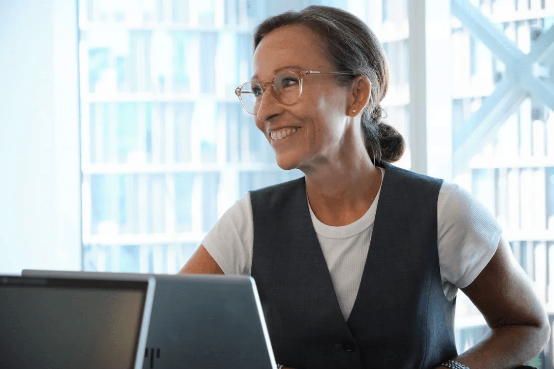 Susanne, a Balder employee, sits with her computer during a meeting at the Copenhagen head office