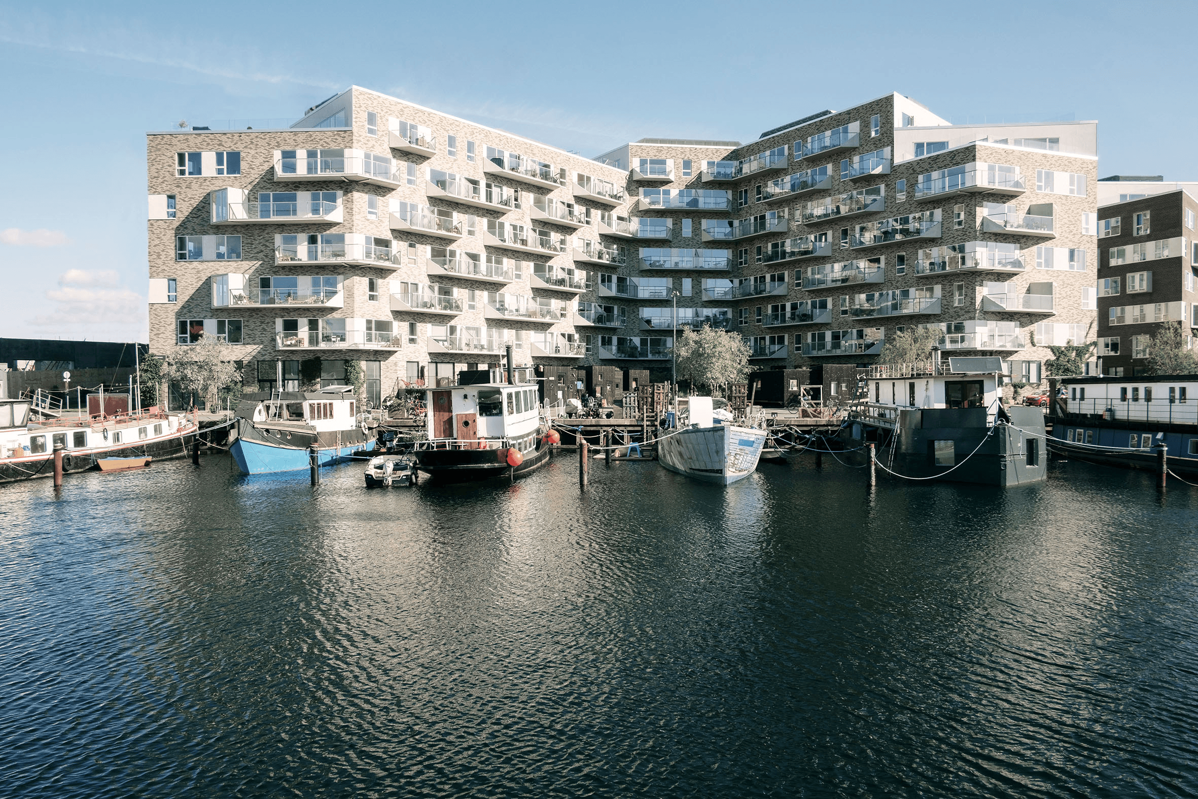 Exterior view of the Skibbroen façade with the waterfront in the foreground