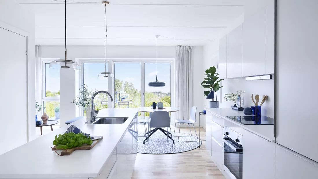 The kitchen-dining area ties the apartment together