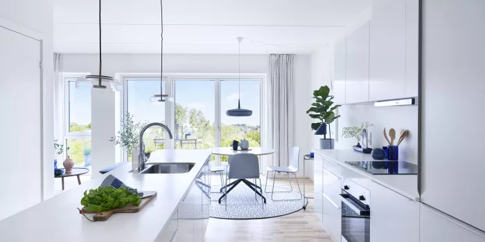 The kitchen-dining area ties the apartment together